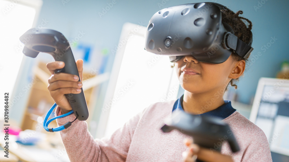 Poster elementary school computer science class: cute girl wearing augmented reality headset and using cont