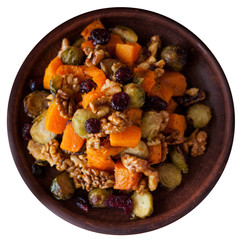 Festive salad with brussels sprout, pumpkin, nuts, cranberries