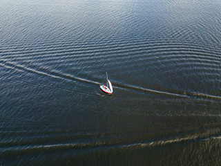 Aerial drone view. Sailboat on the waves