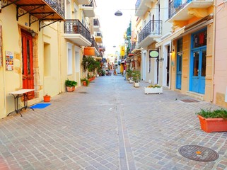 Cozy street with taverns rooms ands cafes from Chania Old Town at Chania in Crete, Greece
