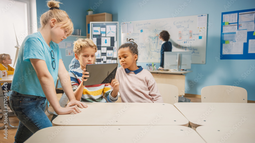 Poster elementary school computer science class: two girls and boy use digital tablet computer with augment