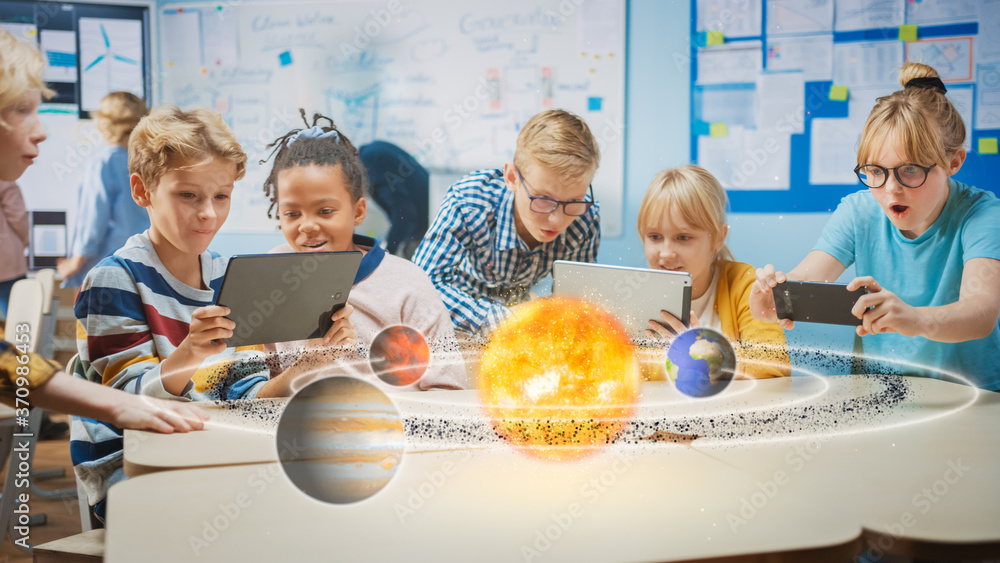 Fototapete Group of School Children in Science Class Use Digital Tablet Computers with Augmented Reality Software, Looking at Educational 3D Animation Of Solar System. VFX, Special Effects Render