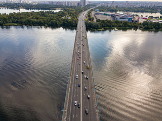 Aerial drone view. Cars travel along the North Bridge across the Dnieper in Kiev.