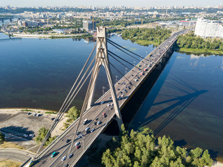 Aerial drone view. Cars travel along the North Bridge across the Dnieper in Kiev.