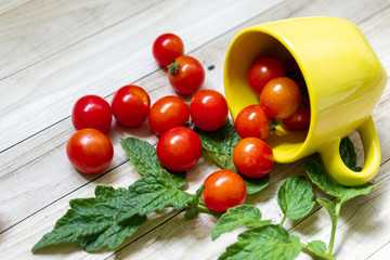 cherry tomatoes on wooden table background