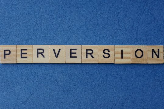 gray word perversion in small square wooden letters with black font on a blue background