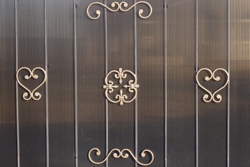 brown wrought iron metal texture on gray metal wall