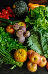 A small variety of fruits and vegetables that have just arrived from the organic fair.