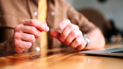 The focus of the gestures of a man next to a laptop