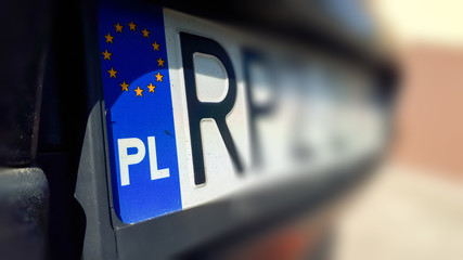 Close-up of Polish registration license car plate.