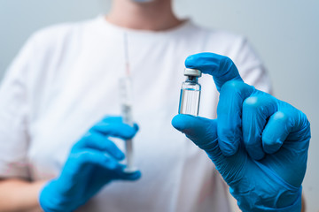 Hands holding Corona virus vaccine dose