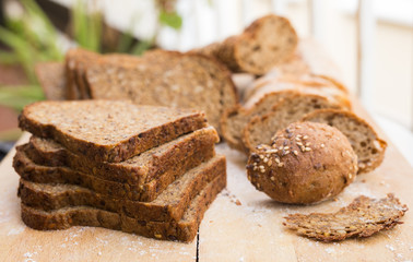 fresh loaf of bread on wooden board