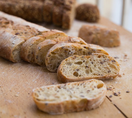fresh loaf of bread on wooden board