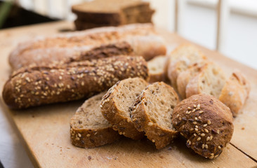 fresh loaf of bread on wooden board