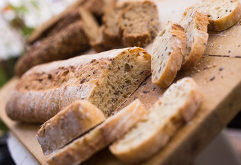 fresh loaf of bread on wooden board