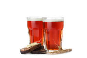 Delicious kvass, bread and spikes on white background