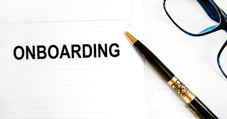 Word writing text Onboarding. Business concept for Action Process of integrating a new employee into an organization Man holding marker notebook page crumpled papers several tries mistakes.