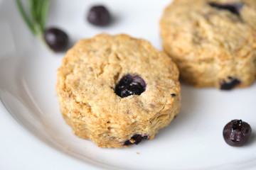 Blueberry scones. a Traditional British baked good for tea time. set on cafe table.