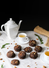 Vegan Almond oatmeal chocolate cookies set in cafe table.