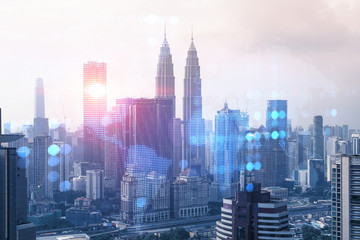 Fototapeta premium World planet Earth map hologram over panorama city view of Kuala Lumpur, Malaysia, Asia. The concept of international connections and business. Multi Exposure.