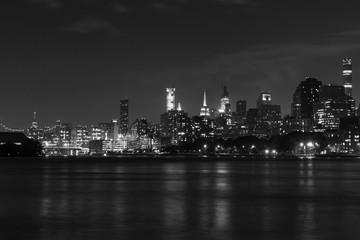 Fototapeta na wymiar Black and White Nighttime Roosevelt Island and Manhattan Skyline along the East River in New York City