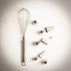 Cake decorating tip set on white background.