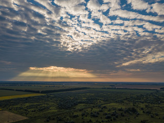 Aerial view. Sunset over Ukrainian agricultural fields.