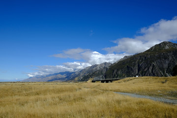 Mountain and farm on scenic road Queenstown New Zealand