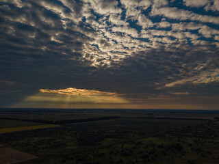 Aerial view. Sunset over Ukrainian agricultural fields.