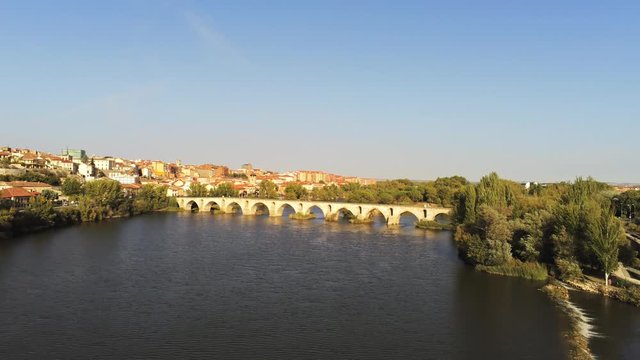 Zamora stone bridge over river. Zamora, historical city of Spain. Aerial Drone Footage 