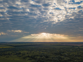 Aerial view. Sunset over Ukrainian agricultural fields.