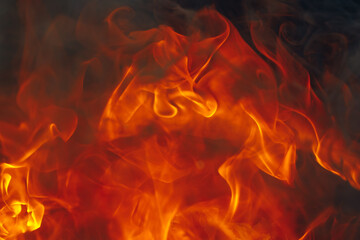 Fototapeta na wymiar blazing fire background with tongues of flame