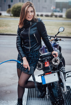 A Cute Girl With Her Custom Motorcycle In Car Wash Service. Smiling And Happy Owner With His Vehicle In City.