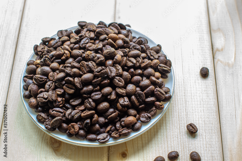 Poster white mug with cup of coffee beans on wooden background with selective focus and crop fragment