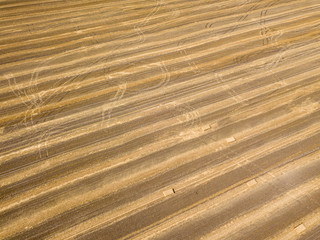 Aerial drone view. Harvested Ukrainian wheat field.