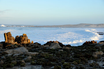 The early morning sun catching the surf in a small bay on the West Coast of South Africa