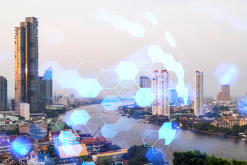 Abstract technology icons hologram over panorama city view of Bangkok, Asia. The concept of people...