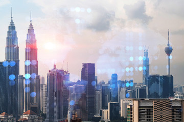 World planet Earth map hologram over panorama city view of Kuala Lumpur, Malaysia, Asia. The concept of international connections and business. Multi Exposure.