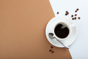 coffee beans and coffee cup on colored background with place for text
