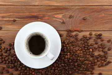 coffee beans and coffee cup on colored background with place for text
