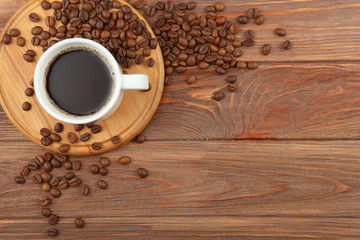 coffee beans and coffee cup on colored background with place for text
