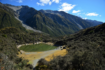 Fototapeta na wymiar Mountain and farm on scenic road Queenstown New Zealand