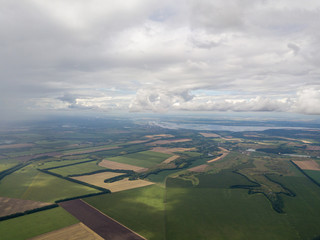 Aerial drone view. Rain clouds over the Ukrainian field. It is raining.