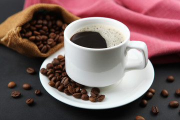 coffee beans and coffee cup on colored background with place for text
