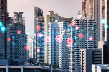 Abstract technology icons hologram over panorama city view of Bangkok, Asia. The concept of people networking and connections. Double exposure.