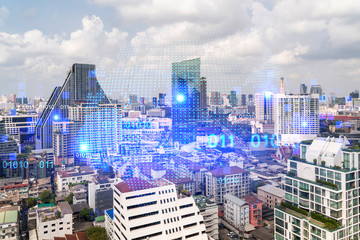 Naklejka premium World planet Earth map hologram over panorama city view of Bangkok, Asia. The concept of international connections and business. Multi Exposure.