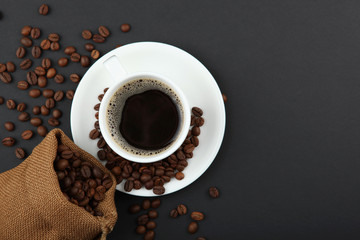 coffee beans and coffee cup on colored background with place for text
