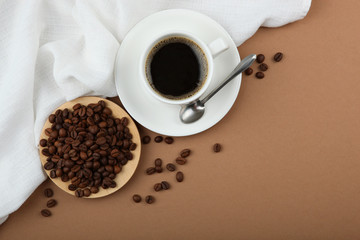 coffee beans and coffee cup on colored background with place for text
