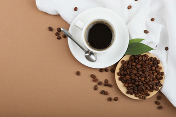 coffee beans and coffee cup on colored background with place for text
