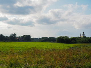 photo of a wide Russian field above a stormy sky